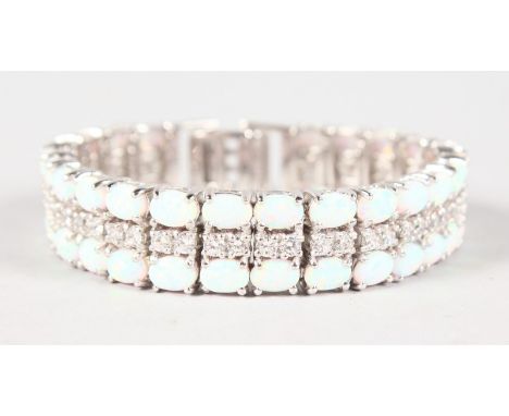 A GOOD SILVER, OPAL AND CUBIC ZIRCONIA TENNIS BRACELET.