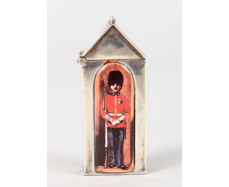 A SILVER NOVELTY MINIATURE SEWING BOX with an enamel soldier on the door.