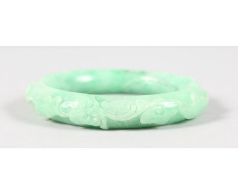 A JADE CARVED BANGLE.