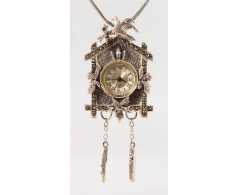 A SILVER NOVELTY CUCKOO CLOCK NECKLACE.
