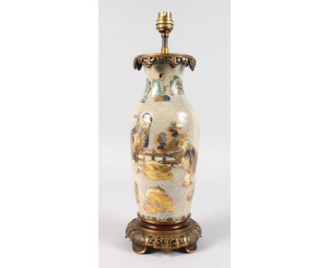A CHINESE CRACKLE GLAZE VASE painted with figures, with gilt mounts, converted to a lamp. 14ins high.