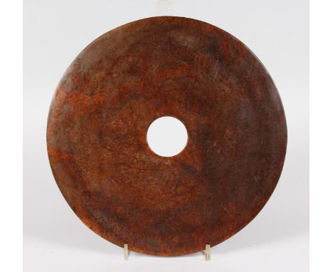 A LARGE JADE BI DISC.  12ins diameter.