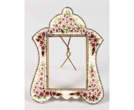 A SMALL FRENCH ENAMEL EASEL PHOTOGRAPH FRAME with flowers in relief.  5ins x 4ins.