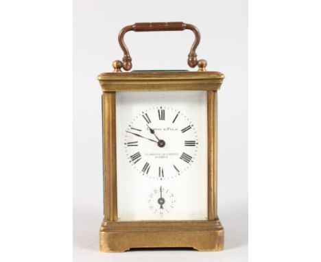 A SMALL 19TH CENTURY FRENCH BRASS CARRIAGE CLOCK by LEROY & FILS, 25 AVENUE DE L'OPERA, PARIS, with alarm and bell. 3.5ins hi