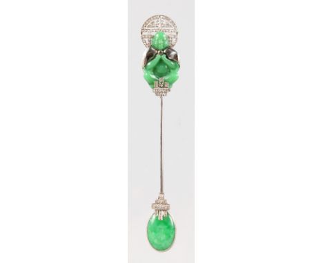A SUPERB CARTIER OF PARIS APPLE GREEN JADE AND DIAMOND SET JABOT PIN, formed as a Chinese carved green jade Buddha. Signed Ca