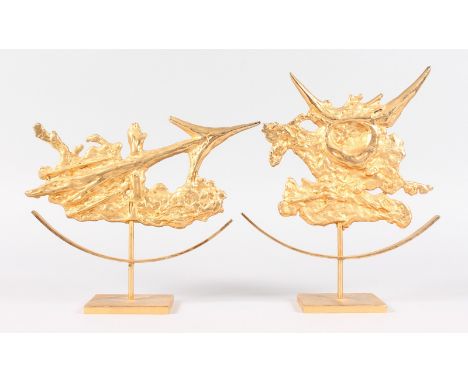A MATCHED PAIR OF ORMOLU ARROW SCULPTURES. Stamped C.H., on a pedestal base.  9.5ins high.