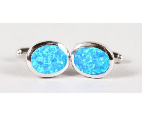 A PAIR OF SILVER AND GILSON OPAL CUFFLINKS.