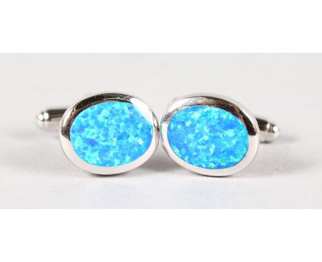 A PAIR OF SILVER AND GILSON OPAL CUFFLINKS.