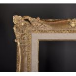 20th Century French School. A Carved Giltwood Frame, with swept and pierced centres and corners, 25"