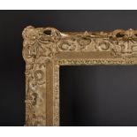 20th Century English School. A Gilt Composition Frame, with swept and pierced centres and corners,
