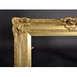19th Century English School. A Gilt Composition Frame, with swept and pierced centres and corners,
