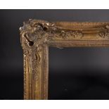 19th Century European School. A Gilt Composition Frame, with swept and pierced centre and corners,