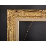 19th Century French School. A Carved Giltwood Frame, with swept and pierced centres and corners, 26"
