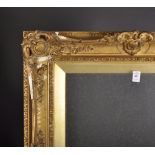 19th Century English School. A Gilt Composition Frame, with swept and pierced centres and corners,