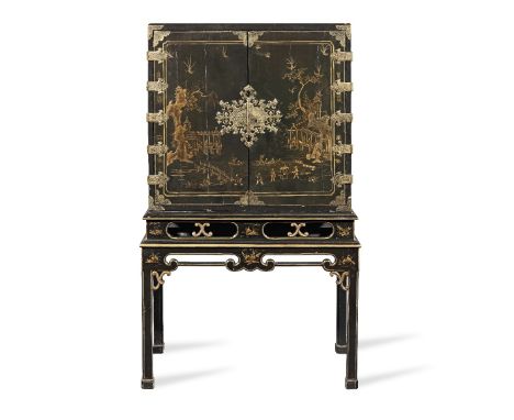 A George I japanned and engraved gilt brass mounted cabinet on a later standThe cabinet: 1710-1725, the stand probably late 1