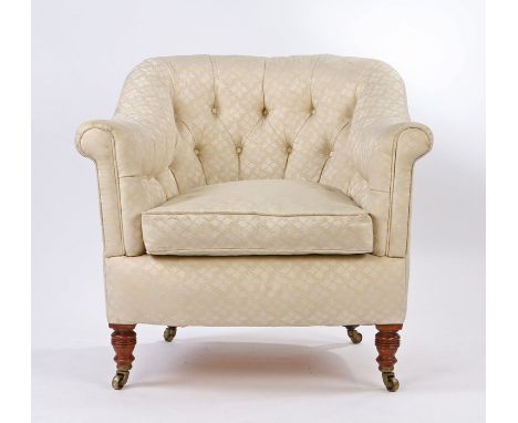 Howard &amp; Sons button back low armchair, the sweeping button back and arms above a feather cushion and ring turned legs, t