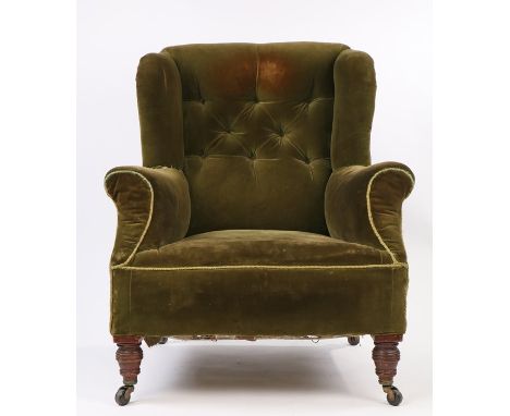 Howard &amp; Sons style Edwardian armchair, the button back with out swept pads above the deep seat and scroll arms raised up