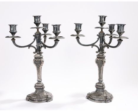 Pair of early 20th century Christofle Gallia metal candelabra, the sconces with cast scroll decoration and gadroon cast drip 