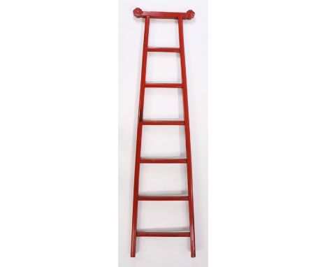 Chinese red lacquer ladder, with a shaped top rail above the tapering steps, 199cm high
