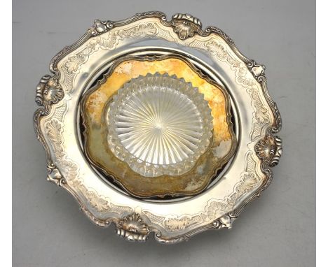 A heavy quality silver muffin dish with cast and engraved rim, Mappin &amp; Webb, London 1925, 14.2 oz, 21 cm diam to/w an As