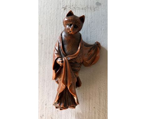 A ersatz netsuke of a cat, 6cm high, wearing a kimono; in the style of a Tokyo School original