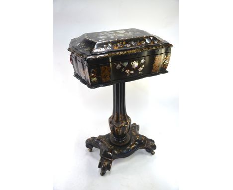 A Victorian mother of pearl and gilt decorated papier mache work table, the hinged top enclosing a fabric lined interior, rai