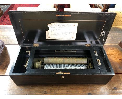 Nicole Freres, Geneva, a late 19th century marquetry inlaid rosewood and ebonised cylinder music box, the 12 cm cylinder play