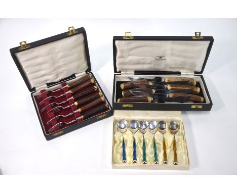 A boxed set of six enamel spoons stamped 'G M Silver', in Naigai Art box, to/w two boxes of steak knives and forks with antle