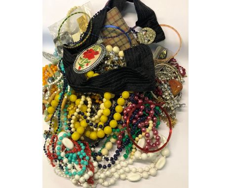 A large collection of vintage and later costume jewellery including beads, brooches, paste set necklaces etc