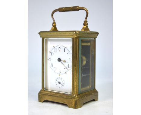 A brass cased French 8-day single train bell strike alarm carriage clock, with white enamelled dial incorporating subsidiary 