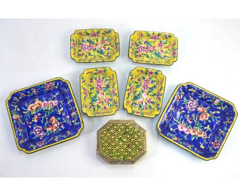 An Indian gilt metal and green enamel snuff box of roughly octagonal form, decorated with a reticulated, floral design on the