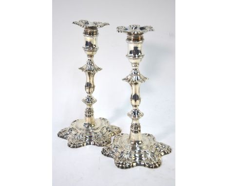 A pair of late George II cast silver baluster candlesticks, the detachable sconces with assay mark only (one heavily obscured