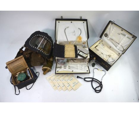 Two WWII vintage midwife's instrument cases and contents by W W Bailey, Oxford St. to/w a gas mask in American cloth cover an