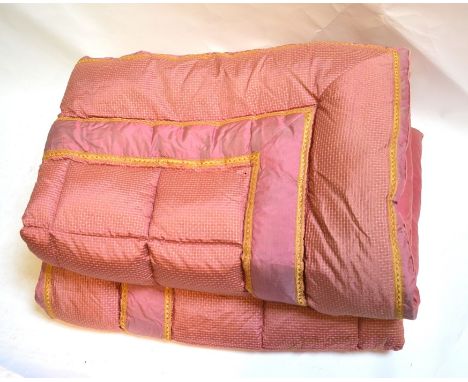 A pair of vieux rose and yellow single feather eiderdowns, to/w a single jade green eiderdown (3)