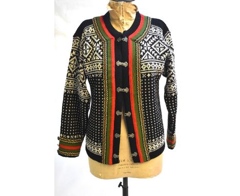 A traditional vintage Norwegian wool jacket with silvered clasps in black/cream/red/green colour-way and a similar cream wool