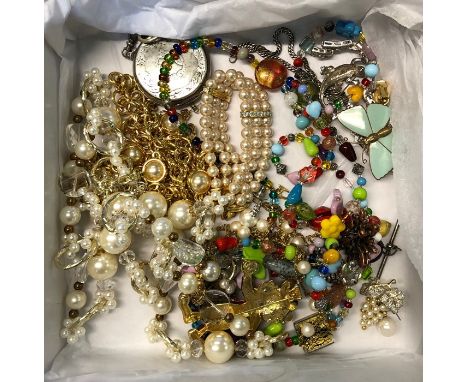 A collection of costume jewellery including Monet gilt metal and pearl necklace, large enamel and gilt metal clown brooch, co