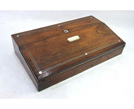 A Victorian mother of pearl inlaid rosewood slope top writing box, the interior with tooled leather surface and fitted for in