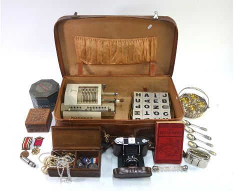 A vintage leather suitcase, containing various collectables, including Zeiss Ikon camera, electroplated egg cruet basket, dou