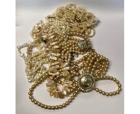 A collection of pearl necklaces including a six row baroque freshwater pearl necklace with matching earrings for pierced ears