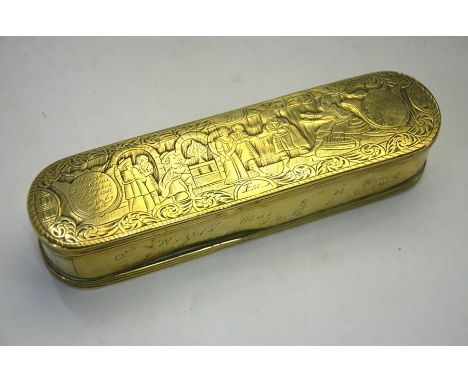A 17th century style Dutch brass snuff box, richly engraved on top and base with court scenes and with text to the front and 