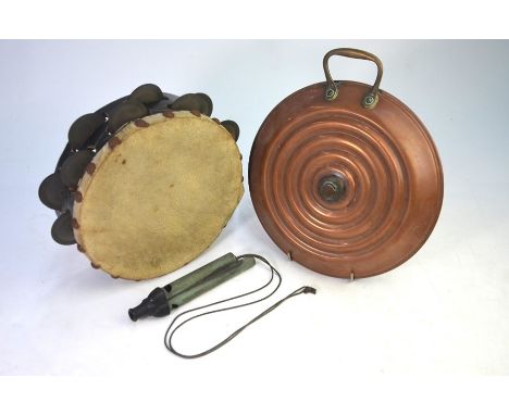 A vintage three-tone train whistle, to/w a tambourine and a circular copper hot-water bottle (3)Tambourine has paint lossesTr