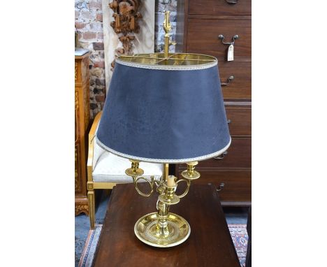 A good quality brass three candle reading lamp with additional rise and fall twin bulb illuminaire, surmounted by a cast bras