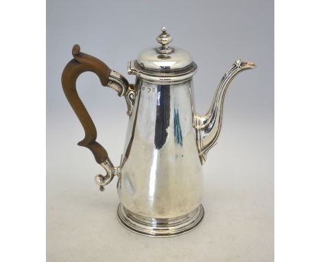 A George II silver coffee pot of plain tapering form, the domed cover with compressed ball knop finial, wooden scroll handle,
