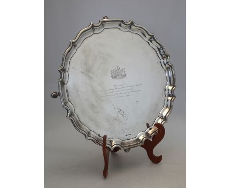 A very heavy quality silver circular pie-crust salver on four hoof feet, maker T.F., Sheffield 1931, 102 oz approx., 43 cm di