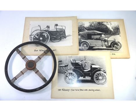 A vintage steering wheel with rubber grip, four wired spokes and MG badge to hub, 44cm diameter, to/w twelve large vintage ph