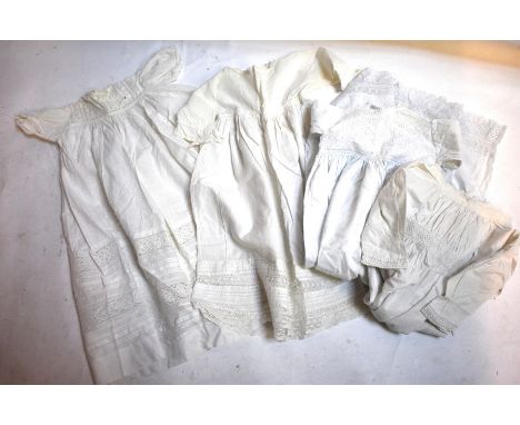 Four Victorian cotton infants' gowns with lace inserts and trim, to/w a collection of 1950s dresses comprising; a smocked sil