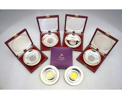 Four cased silver pin-dishes, set with commemorative crowns (cupro-nickel) to/w two boxed Aspreys commemorative pin-trays wit