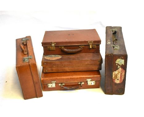 A collection of five small vintage leather suitcases (couple of travel labels) and a vintage large Gladstone style portmantea