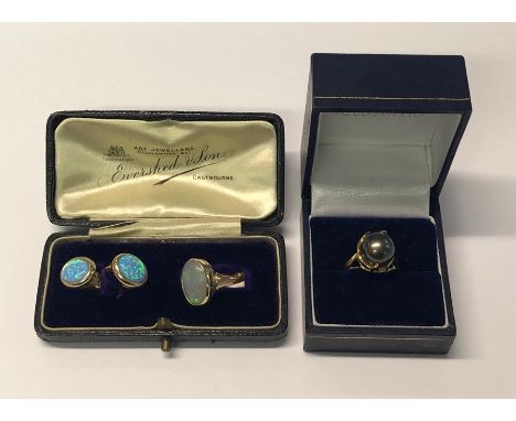 A yellow metal ring set oval opal, stamped 9ct, size K and a pair of opal set clip on earrings to/w a yellow metal ring with 