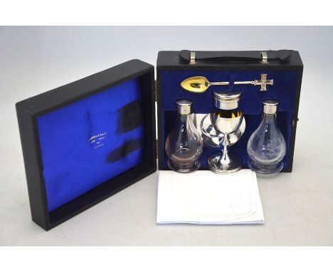 A silver parcel gilt travelling Holy Communion set, comprising:&nbsp; chalice, paten, pyx (wafer box) and spoon with cross fi